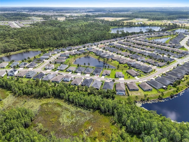 17676 Passionflower Cir, Clermont, FL 34714 - aerial view of property's location with a large body of water and nearby suburban area