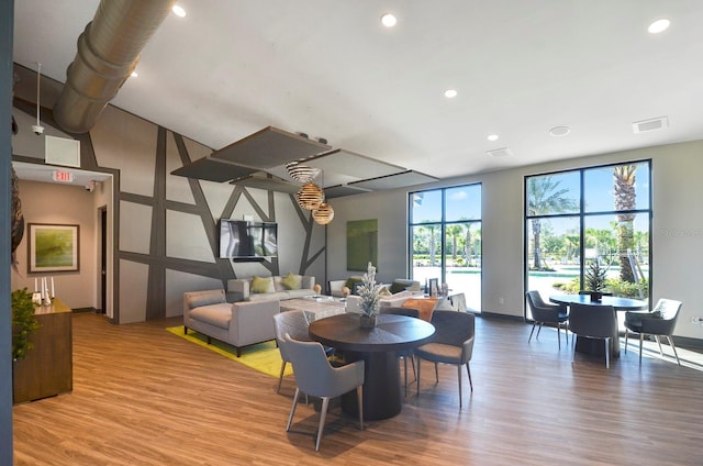 17676 Passionflower Cir, Clermont, FL 34714 - dining space featuring wood finished floors and recessed lighting