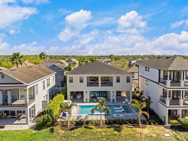 1526 Euston Dr, Reunion, FL 34747 - rear view of property featuring a balcony, a residential view, outdoor lounge area, and a patio area