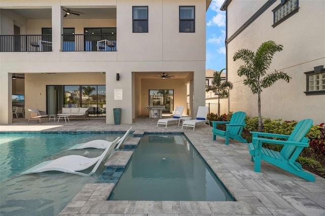 1526 Euston Dr, Reunion, FL 34747 - back of house featuring a ceiling fan, an outdoor living space, and stucco siding