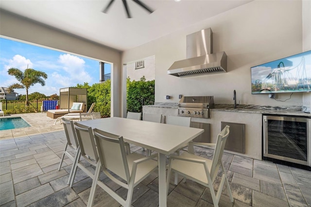 1526 Euston Dr, Reunion, FL 34747 - view of patio featuring wine cooler, an outdoor kitchen, and outdoor dining area