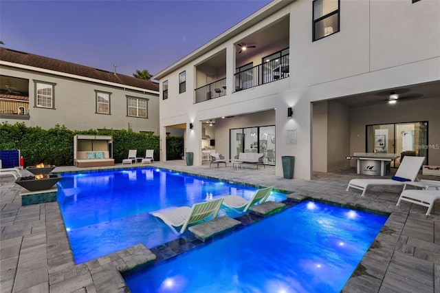 1526 Euston Dr, Reunion, FL 34747 - view of pool with an outdoor living space with a fire pit, a patio area, a pool with connected hot tub, and ceiling fan