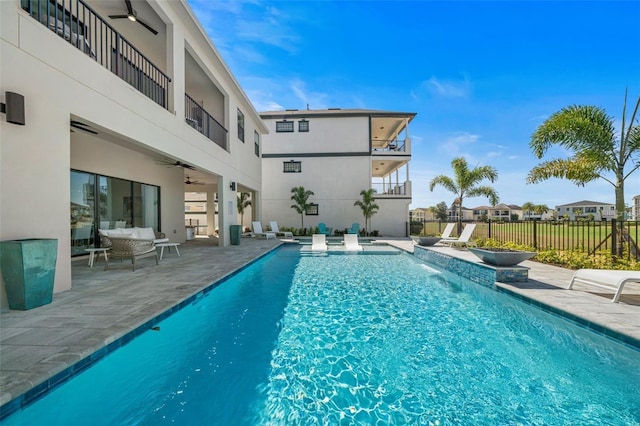 1526 Euston Dr, Reunion, FL 34747 - view of pool featuring ceiling fan, a patio, and an outdoor living space