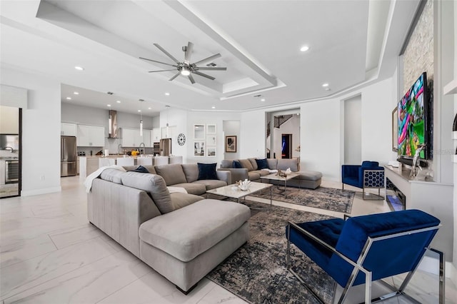 1526 Euston Dr, Reunion, FL 34747 - living area with a raised ceiling, light marble finish flooring, recessed lighting, and ceiling fan