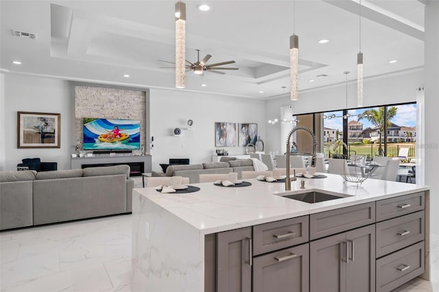 1526 Euston Dr, Reunion, FL 34747 - kitchen featuring gray cabinets, open floor plan, recessed lighting, a ceiling fan, and light stone countertops