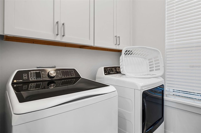 1526 Euston Dr, Reunion, FL 34747 - washroom featuring cabinet space and washer and dryer