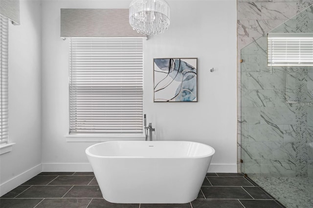 1526 Euston Dr, Reunion, FL 34747 - full bath featuring a freestanding bath, a marble finish shower, and tile patterned floors