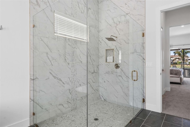 1526 Euston Dr, Reunion, FL 34747 - ensuite bathroom featuring a marble finish shower and tile patterned flooring