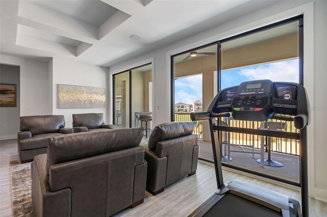 1526 Euston Dr, Reunion, FL 34747 - living area with wood finished floors, a ceiling fan, and coffered ceiling