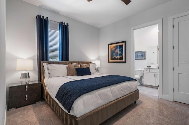 1526 Euston Dr, Reunion, FL 34747 - bedroom with light carpet and connected bathroom