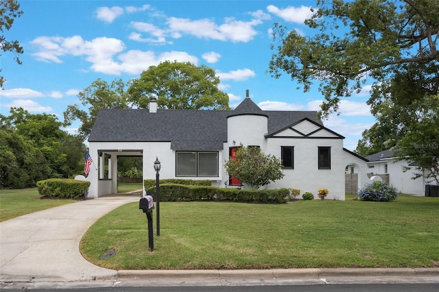 2101 Lily Ct, Sanford, FL 32771 - view of front facade with a front yard, stucco siding, and concrete driveway