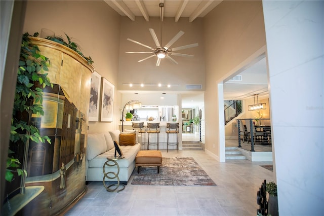 4203 Fairway Run, Tampa, FL 33618 - living room featuring beam ceiling, a ceiling fan, a towering ceiling, and tile patterned flooring