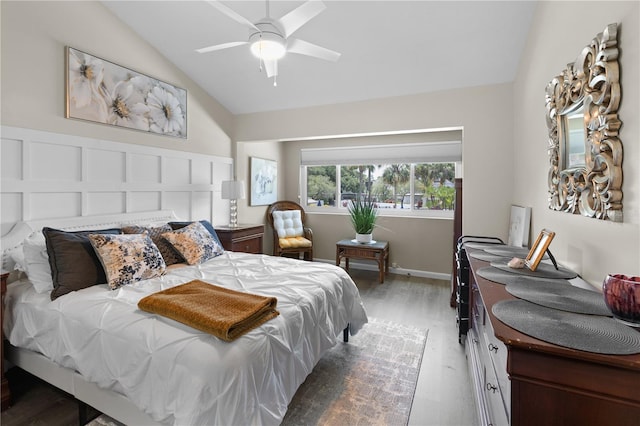 4203 Fairway Run, Tampa, FL 33618 - bedroom with lofted ceiling, wood finished floors, and a ceiling fan