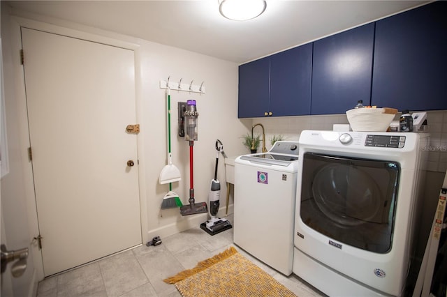 4203 Fairway Run, Tampa, FL 33618 - laundry area with cabinet space, independent washer and dryer, and light tile patterned floors