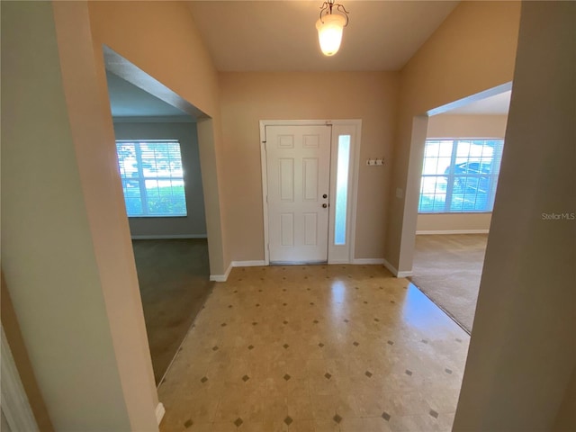 1227 Juniper Hammock St, Winter Garden, FL 34787 - entrance foyer with light colored carpet, healthy amount of natural light, and light flooring