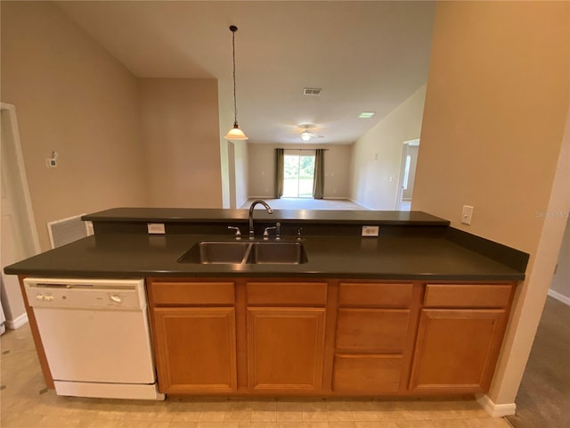 1227 Juniper Hammock St, Winter Garden, FL 34787 - kitchen featuring white dishwasher, dark countertops, open floor plan, hanging light fixtures, and brown cabinets