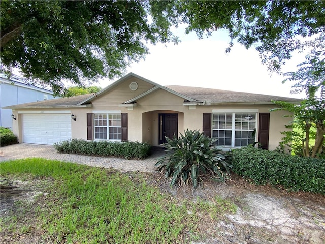 1227 Juniper Hammock St, Winter Garden, FL 34787 - single story home with stucco siding and an attached garage