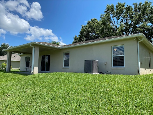1227 Juniper Hammock St, Winter Garden, FL 34787 - back of property with stucco siding and a lawn