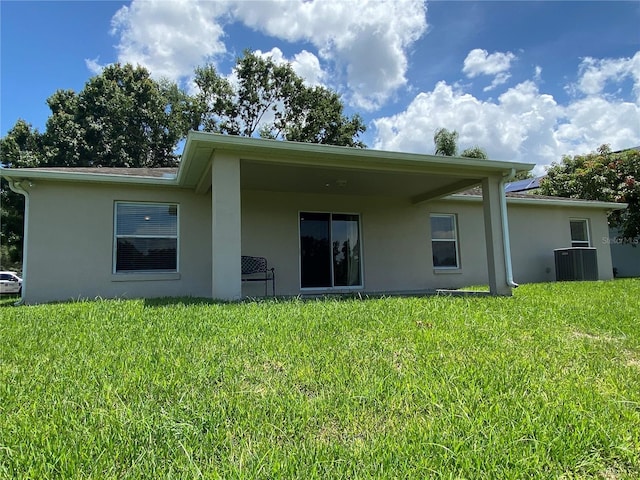 1227 Juniper Hammock St, Winter Garden, FL 34787 - back of property featuring stucco siding and a lawn
