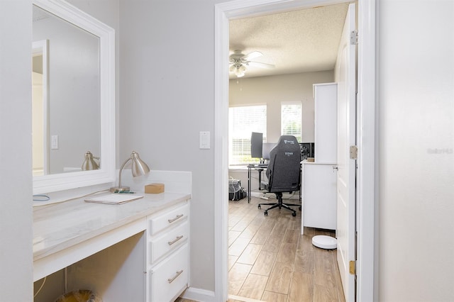 12204 Wild Iris Way Unit 108, Orlando, FL 32837 - office space with light wood finished floors, a ceiling fan, and a textured ceiling