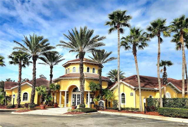 12204 Wild Iris Way Unit 108, Orlando, FL 32837 - view of building exterior featuring uncovered parking