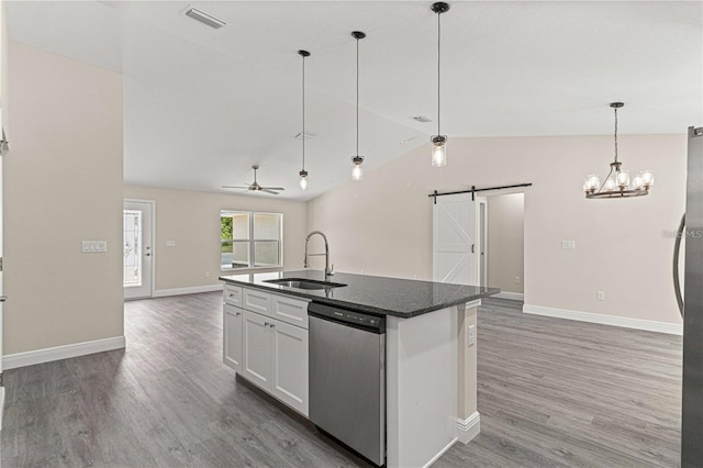 12756 SW 80th St, Dunnellon, FL 34432 - kitchen featuring dishwasher, open floor plan, a barn door, lofted ceiling, and wood finished floors