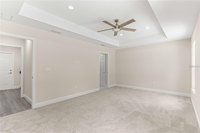 12756 SW 80th St, Dunnellon, FL 34432 - unfurnished room with a raised ceiling, light carpet, ceiling fan, and recessed lighting