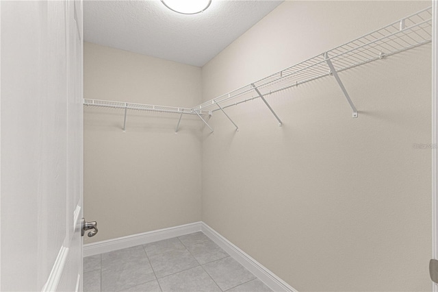 12756 SW 80th St, Dunnellon, FL 34432 - walk in closet featuring light tile patterned flooring