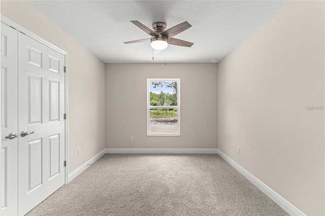 12756 SW 80th St, Dunnellon, FL 34432 - spare room featuring carpet flooring, a ceiling fan, and a textured ceiling