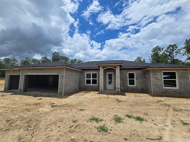 12756 SW 80th St, Dunnellon, FL 34432 - view of front facade featuring a garage and concrete block siding