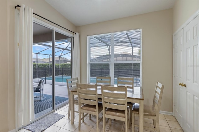 2222 Wyndham Palms Way, Kissimmee, FL 34747 - dining area with light tile patterned floors and a sunroom
