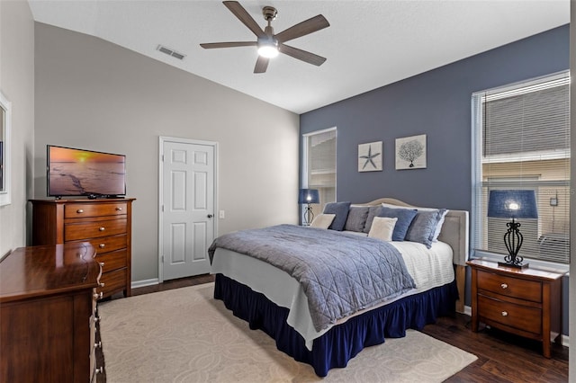 2222 Wyndham Palms Way, Kissimmee, FL 34747 - bedroom with vaulted ceiling, wood finished floors, and ceiling fan