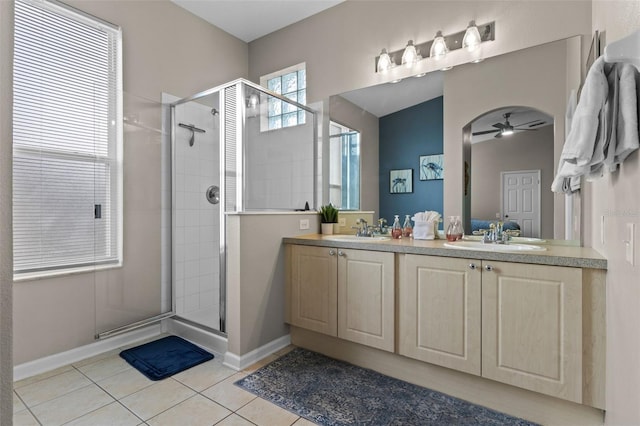 2222 Wyndham Palms Way, Kissimmee, FL 34747 - bathroom with a stall shower, tile patterned flooring, double vanity, and ceiling fan