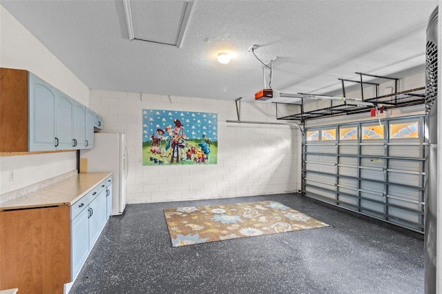 2222 Wyndham Palms Way, Kissimmee, FL 34747 - garage with freestanding refrigerator, concrete block wall, and a garage door opener
