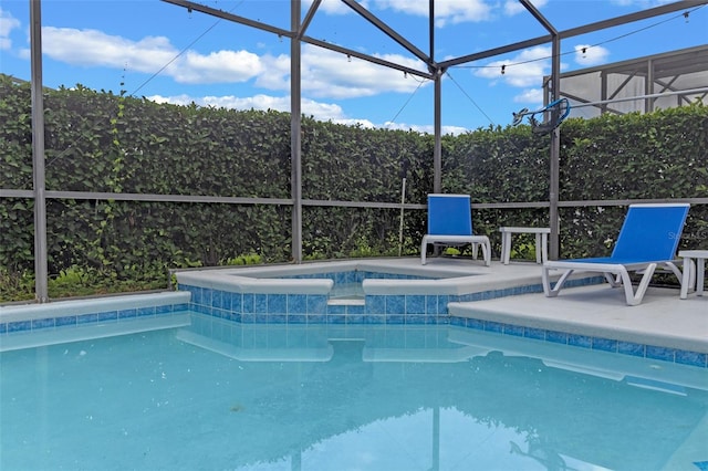 2222 Wyndham Palms Way, Kissimmee, FL 34747 - view of pool with glass enclosure, a pool with connected hot tub, and a patio