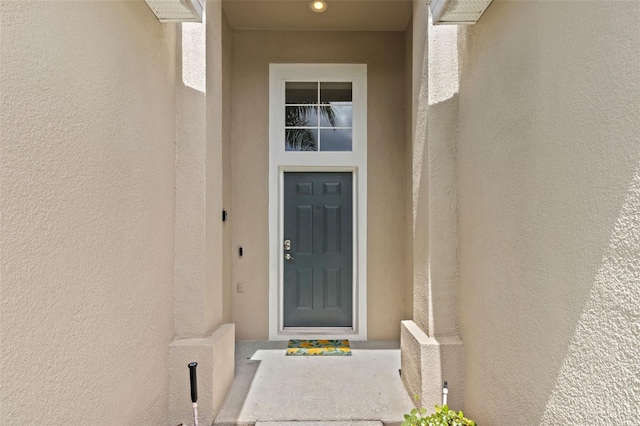 2222 Wyndham Palms Way, Kissimmee, FL 34747 - doorway to property featuring stucco siding