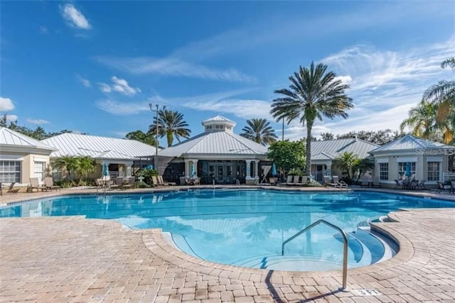 2222 Wyndham Palms Way, Kissimmee, FL 34747 - community pool with a patio area