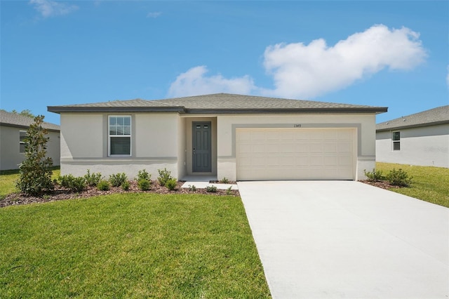 1349 Oak Valley Dr, Auburndale, FL 33823 - view of front of home with a garage, stucco siding, driveway, and a front yard