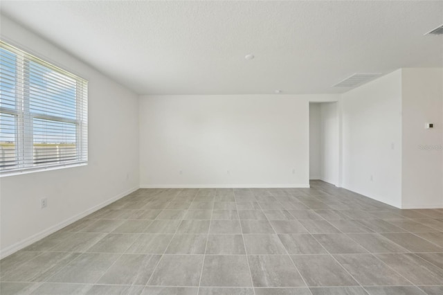 1349 Oak Valley Dr, Auburndale, FL 33823 - empty room featuring a textured ceiling and baseboards