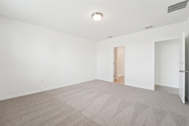 1349 Oak Valley Dr, Auburndale, FL 33823 - unfurnished bedroom with light carpet and baseboards