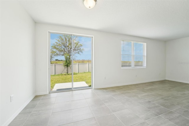 1349 Oak Valley Dr, Auburndale, FL 33823 - spare room with light tile patterned floors and baseboards