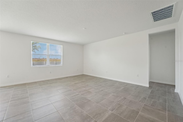 1349 Oak Valley Dr, Auburndale, FL 33823 - spare room with a textured ceiling and baseboards