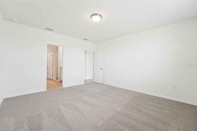1349 Oak Valley Dr, Auburndale, FL 33823 - spare room with light colored carpet and a smoke detector