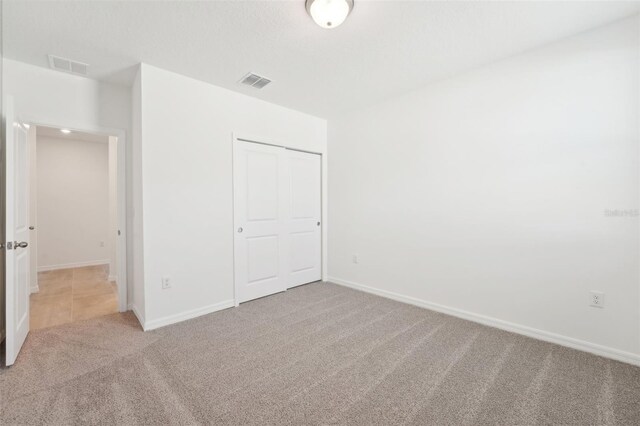 1349 Oak Valley Dr, Auburndale, FL 33823 - unfurnished bedroom featuring carpet and a closet