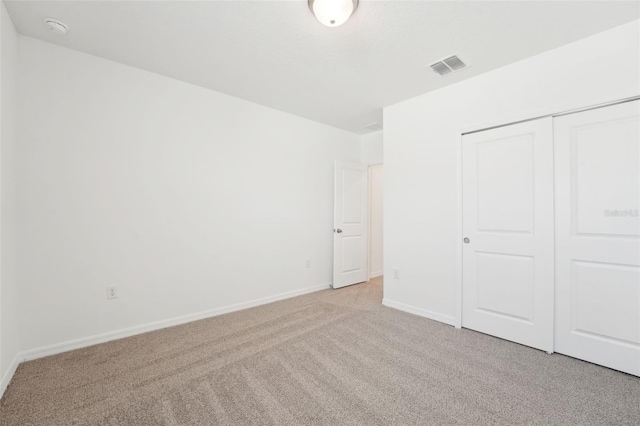 1349 Oak Valley Dr, Auburndale, FL 33823 - unfurnished bedroom with light carpet and a closet