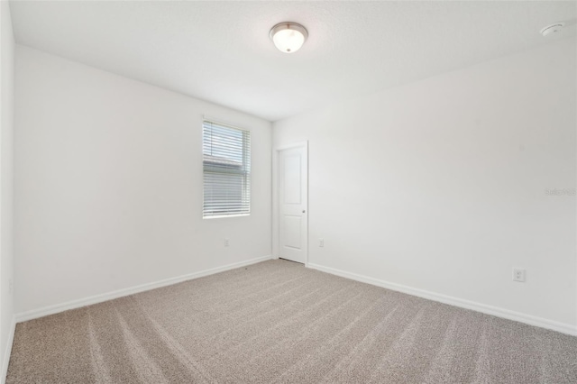 1349 Oak Valley Dr, Auburndale, FL 33823 - spare room with light colored carpet and baseboards