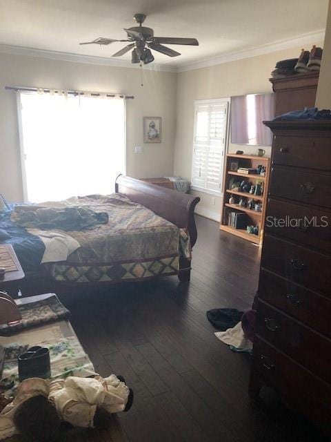 310 W Lake Ave, Auburndale, FL 33823 - bedroom featuring wood-type flooring, ornamental molding, and ceiling fan