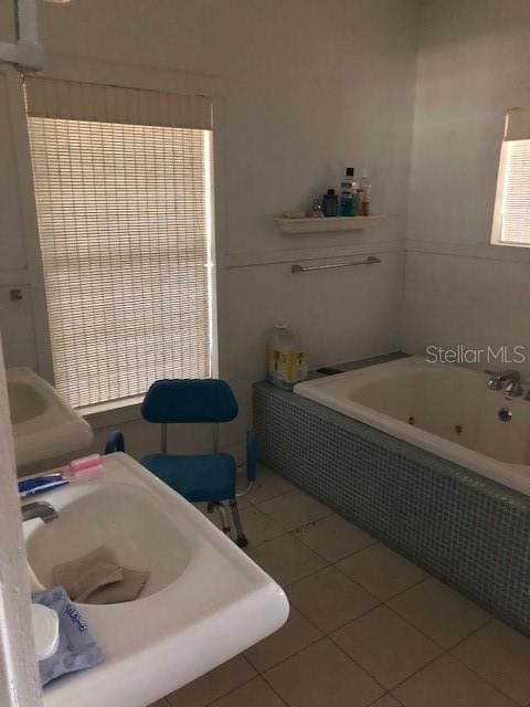 310 W Lake Ave, Auburndale, FL 33823 - full bathroom featuring a jetted tub and tile patterned floors