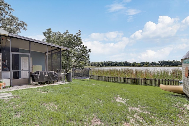 369 Bluff Lake Rd, Mascotte, FL 34753 - view of yard featuring a trampoline and a sunroom