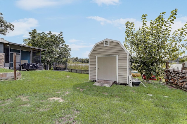 369 Bluff Lake Rd, Mascotte, FL 34753 - view of yard featuring a storage unit and a sunroom